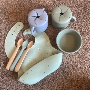 Set of Mushie baby feeding gear